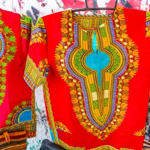 Save up to <span style="color: #4a7931">£10</span> on top African men's top.